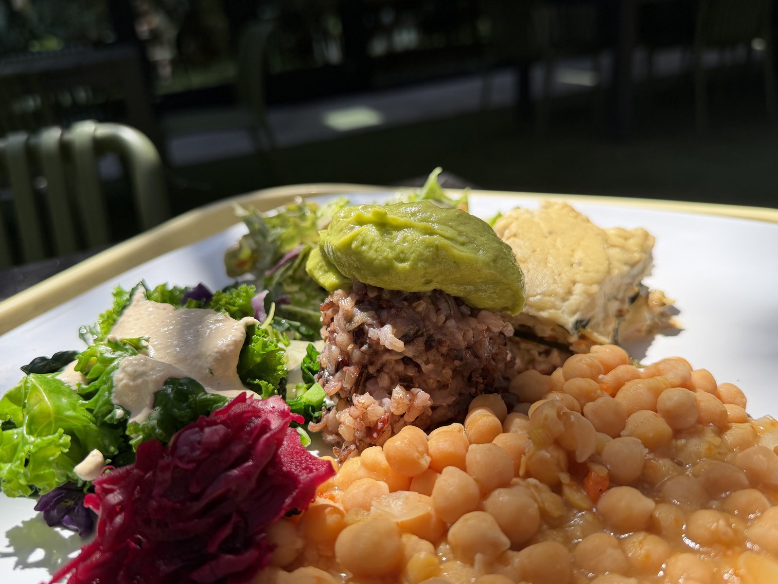 A Casa de Luz East plate of whole-food plant-based dishes served al fresco